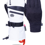 The 686 Women's GORE-TEX SMARTY 3-in-1 Gauntlet Mitt has a white body with black accents and a red interior, featuring a large zipper on the wrist.
