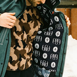 The 686 Dojo Shell Jacket in dark green has an insulated hood and a zippered front.