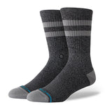 JOVEN CREW C SOCK MEN'S 2025 - A pair of gray crew socks with a small white logo on the front and blue accents at the toes.
