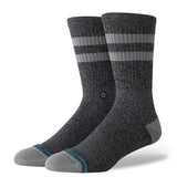 JOVEN CREW C SOCK MEN'S 2025 - A pair of gray crew socks with a small white logo on the front and blue accents at the toes.