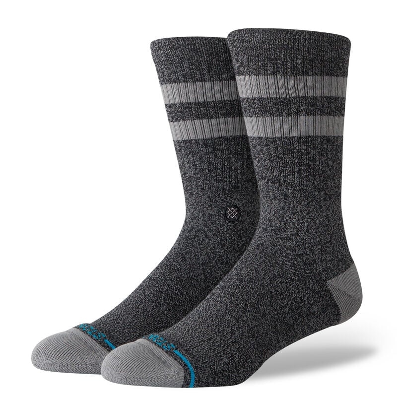 JOVEN CREW C SOCK MEN'S 2025 - A pair of gray crew socks with a small white logo on the front and blue accents at the toes.