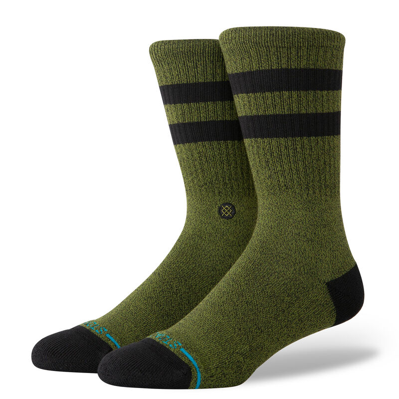 JOVEN CREW C SOCK MENS 2025 - A pair of green crew socks with black stripes and a small logo on the front.