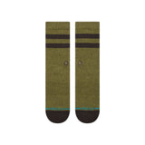 JOVEN CREW C SOCK MENS 2025 - A pair of olive green crew socks with a small black logo featuring an "X" shape in the center.