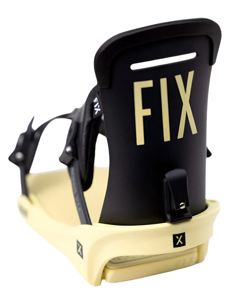 Fix Women's January Snowboard Binding 2024 - A black snowboard binding with a rectangular metal plate and silver screws on top of a cream-colored baseplate.