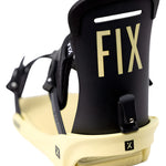 Fix Women's January Snowboard Binding 2024 - A black snowboard binding with a rectangular metal plate and silver screws on top of a cream-colored baseplate.