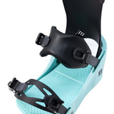 Fix Women's January Snowboard Binding 2024 - A black snowboard binding with a strap and buckle on top of a light teal base plate.