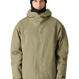 The 686 Gateway Shell Jacket 2025 is olive green with a hood and a front zip closure.