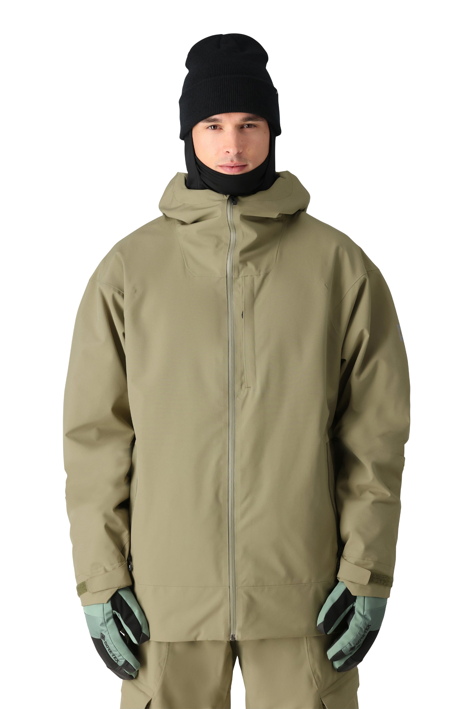 The 686 Gateway Shell Jacket 2025 is olive green with a hood and a front zip closure.