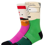 MR GARRISON CREW C SOCK 2023 - A pair of crew socks with a cartoon image of Mr. Garrison from South Park on them, featuring his signature red hair and glasses.