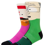 MR GARRISON CREW C SOCK 2023 - A pair of crew socks with a cartoon image of Mr. Garrison from South Park on them, featuring his signature red hair and glasses.