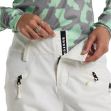 Burton Women's Marcy 2L High Rise Stretch Pants 2025 - A pair of white snow pants with a black stripe down the side and zippered pockets.