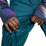 Burton Cargo 2L Shell Pants 2025 - A pair of dark green snow pants with a zippered pocket on the thigh and adjustable cuffs.