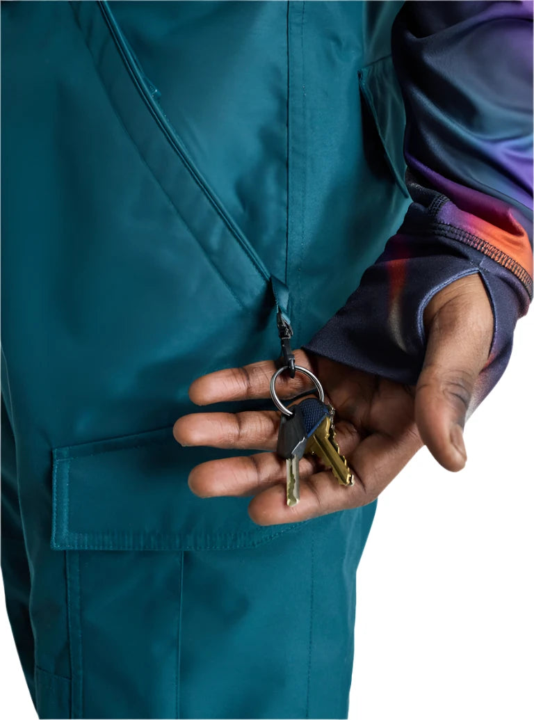 Burton Cargo 2L Shell Pants 2025 - A pair of dark green snow pants with a zippered pocket on the thigh and a black logo patch near the right hip.