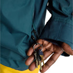 Burton Frostner 2L Jacket 2025 - A dark green jacket with a zipper down the front and two zippered pockets on either side.