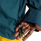 Burton Frostner 2L Jacket 2025 - A dark green jacket with a zipper down the front and two zippered pockets on either side.