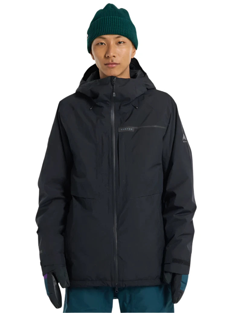 Burton Pillowline GORE-TEX Jacket 2025 - A black jacket with a hood and zippered pockets, featuring a prominent "BURTON" logo on the chest.