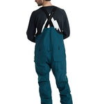Burton Reserve Bib Pant 2025 - Dark-colored bib pants with a white logo on the left leg and black straps over the shoulders.
