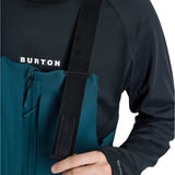 Burton Reserve Bib Pant 2025 - A pair of dark blue snow pants with a zippered pocket on the thigh and adjustable straps at the waist.