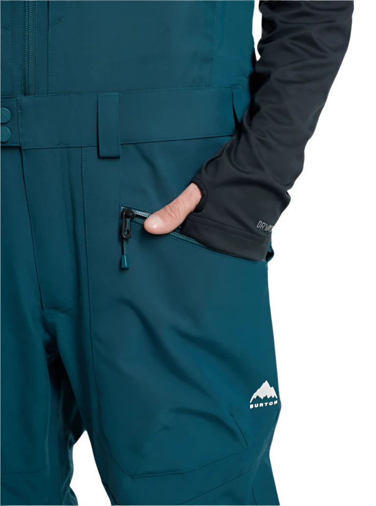Burton Reserve Bib Pant 2025 - Dark-colored bib pant with a white logo on the left leg and black zippers.