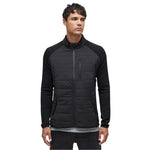 Le Bent Pramecou Wool Insulated Hybrid Jacket 2025 - A black jacket with a zippered chest pocket and two side pockets, featuring a quilted pattern on the front and sleeves.