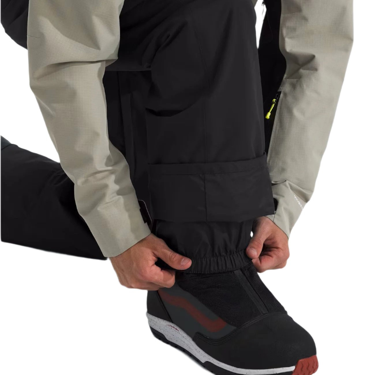 North Face Men's Freedom Insulated Pant - A pair of black insulated pants with a zippered pocket on the side.