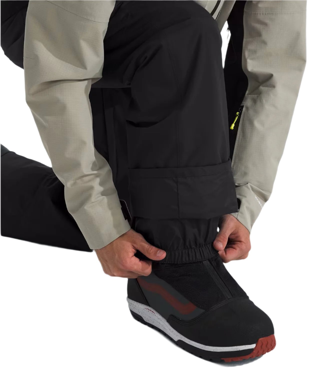 North Face Men's Freedom Insulated Pant - A pair of black insulated pants with a zippered pocket on the side.
