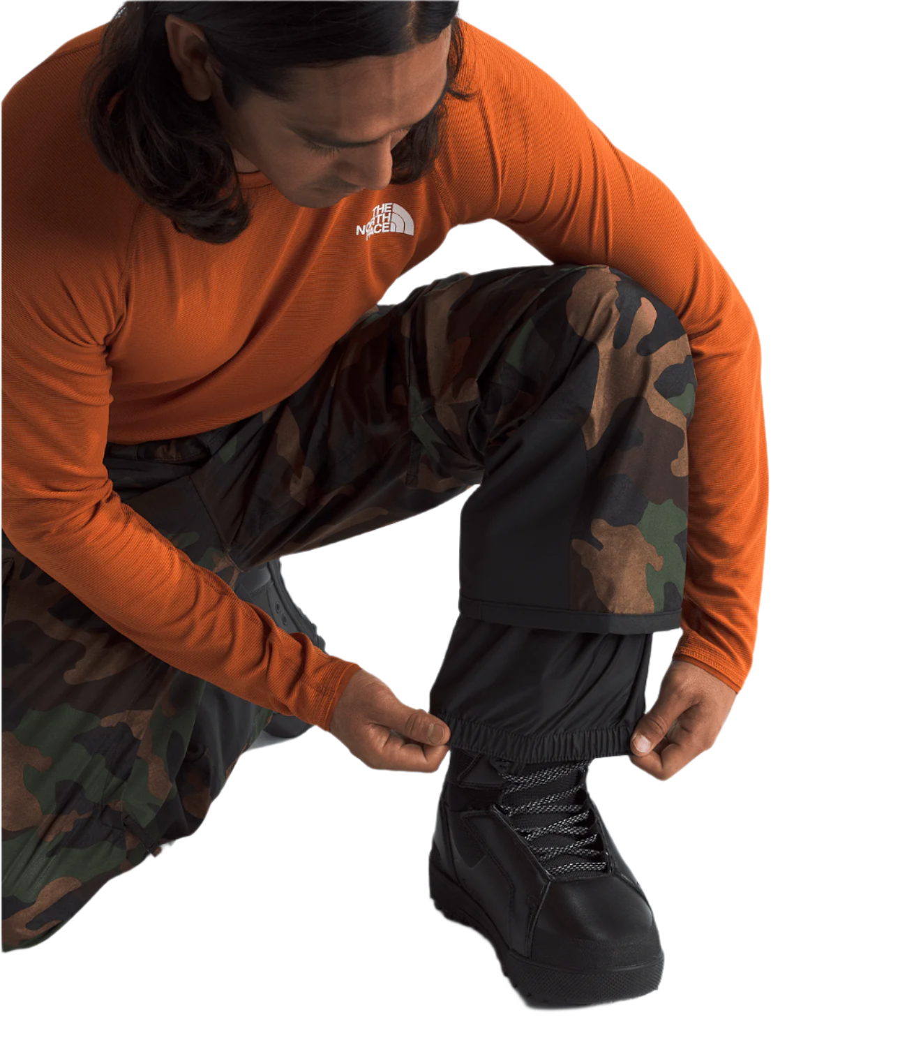 North Face Freedom Shell Pant - A pair of black pants with a subtle green pattern on the side, featuring a zippered pocket and adjustable cuffs.