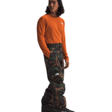 North Face Freedom Shell Pant 2025 - A dark green, camouflage-patterned pant with a white logo on the left thigh.