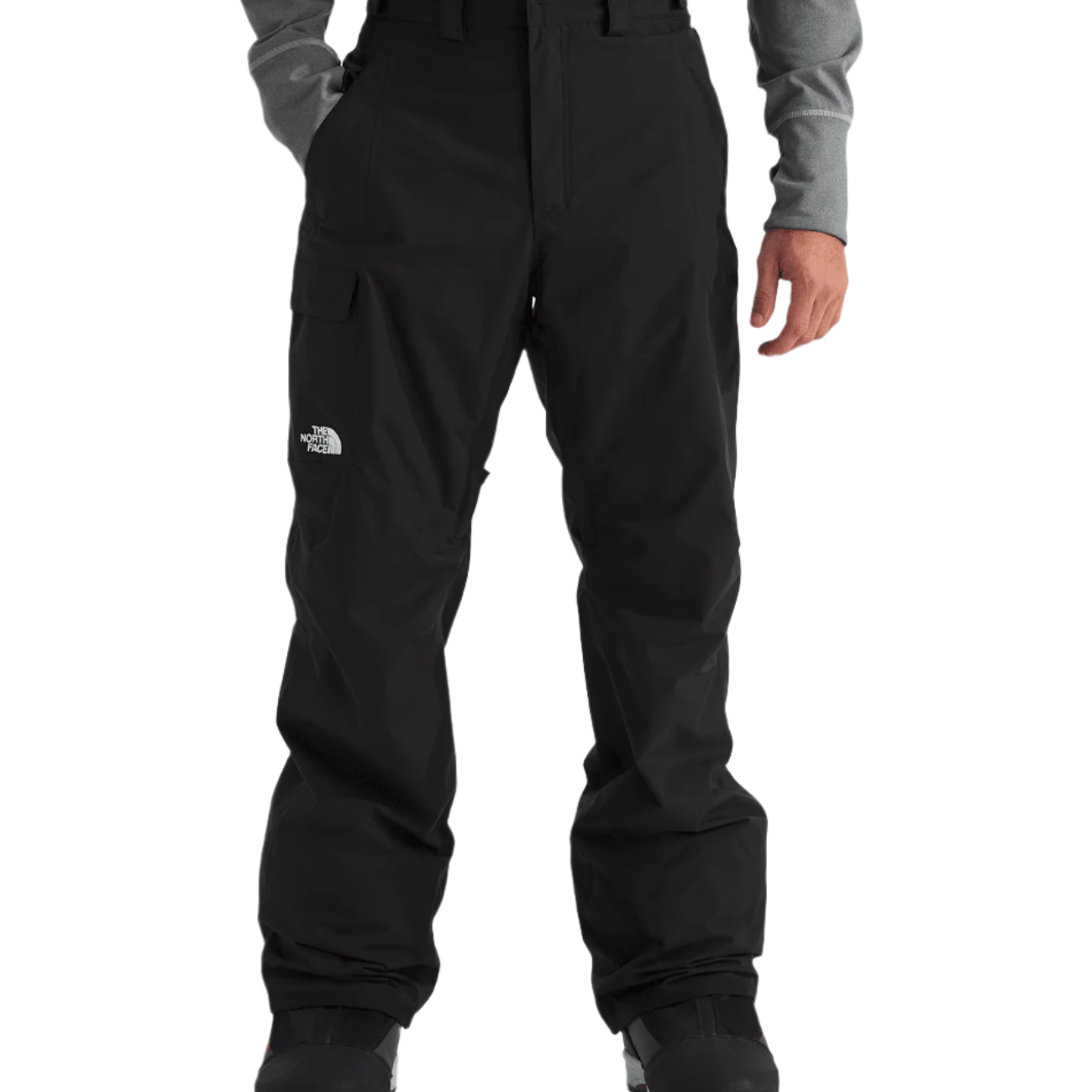North Face Freedom Shell Pant 2025 - A pair of black pants with a white logo on the left thigh and a zippered pocket on the right leg.