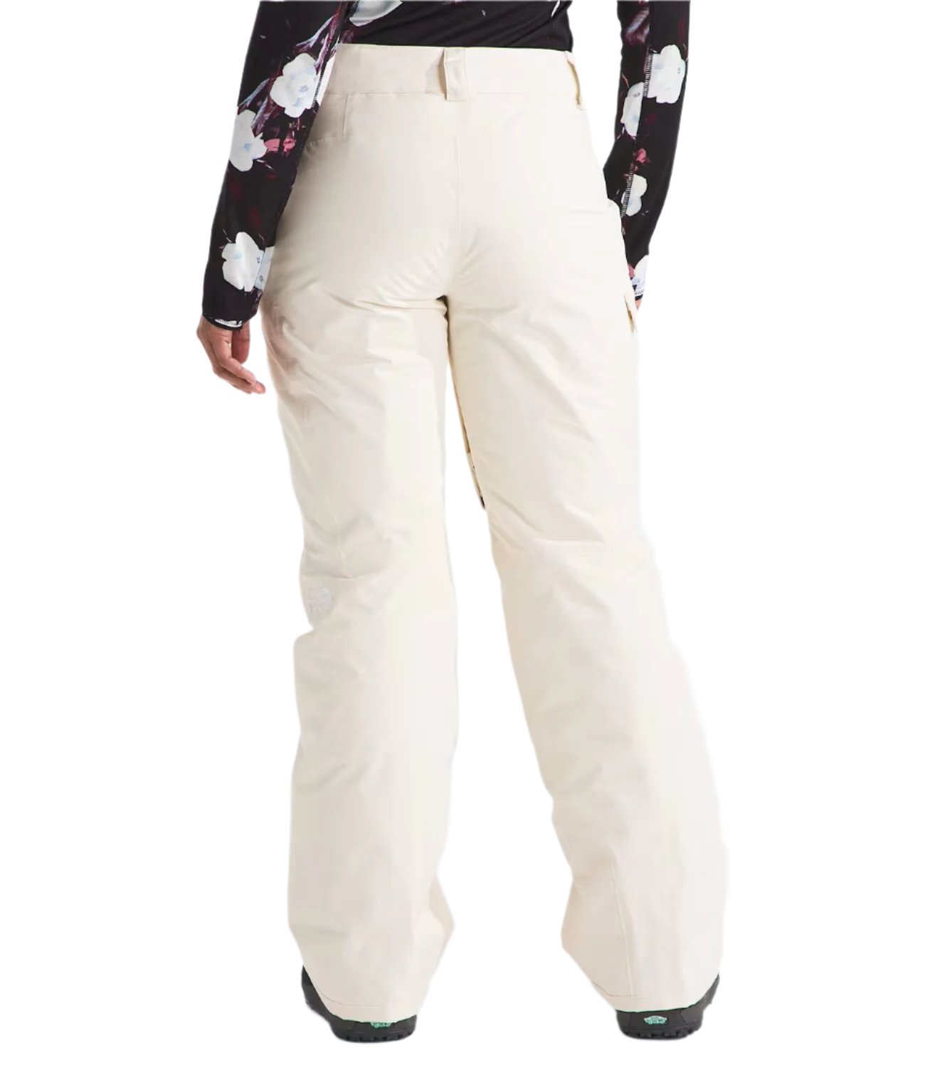 North Face Women's Freedom Insulated Pant - A pair of off-white snow pants with a subtle white pattern on the left thigh and right calf, featuring a zippered pocket on the back.