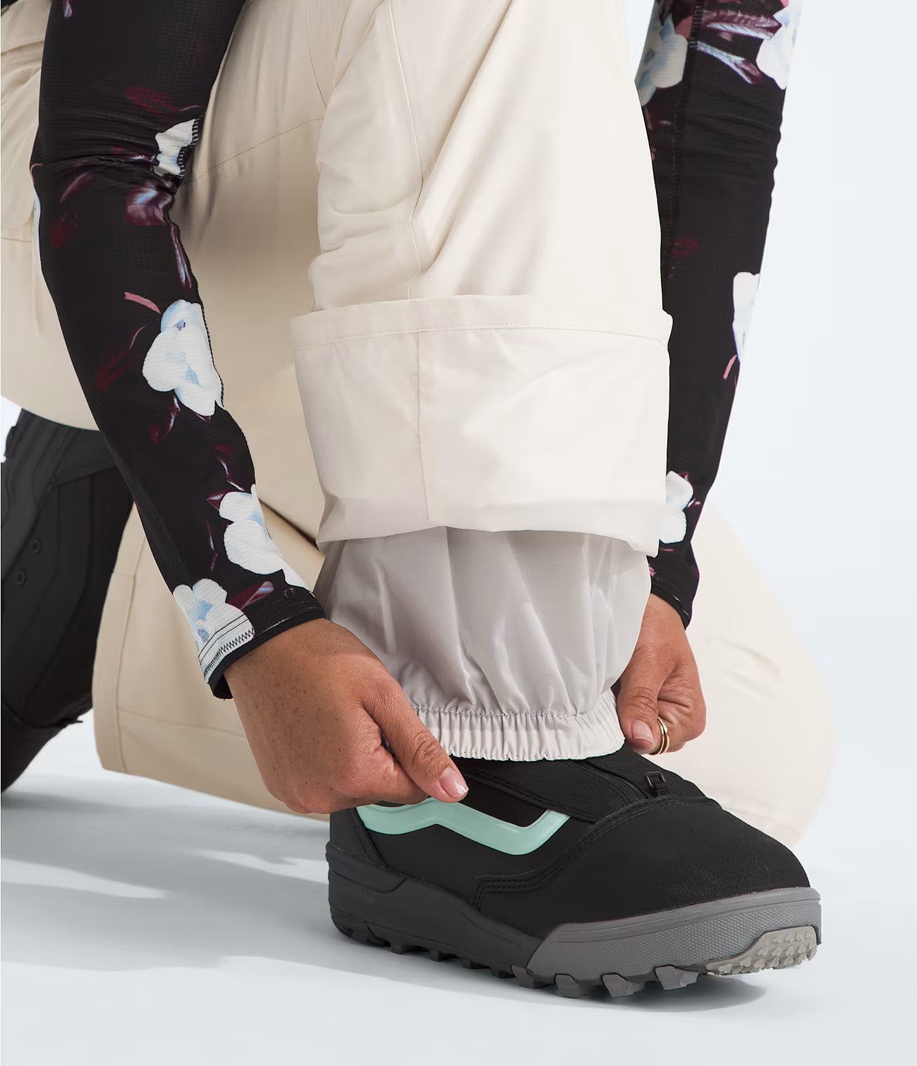 North Face Women's Freedom Insulated Pant - A pair of black insulated pants with a subtle white logo on the left thigh.