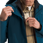 North Face Carto Triclimate Jacket - A blue jacket with a black zipper and two zippered pockets on either side of the waist.
