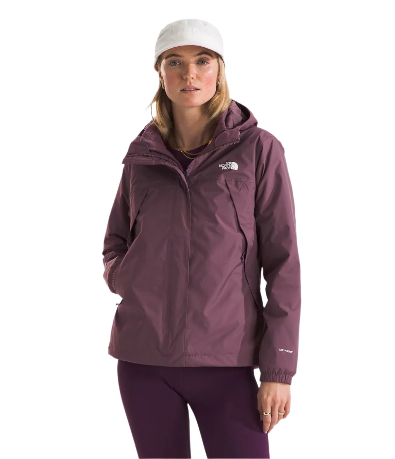 North Face Women's Antora Triclimate Jacket - A woman wearing a purple jacket with a white logo on the left chest, standing against a light gray background.
