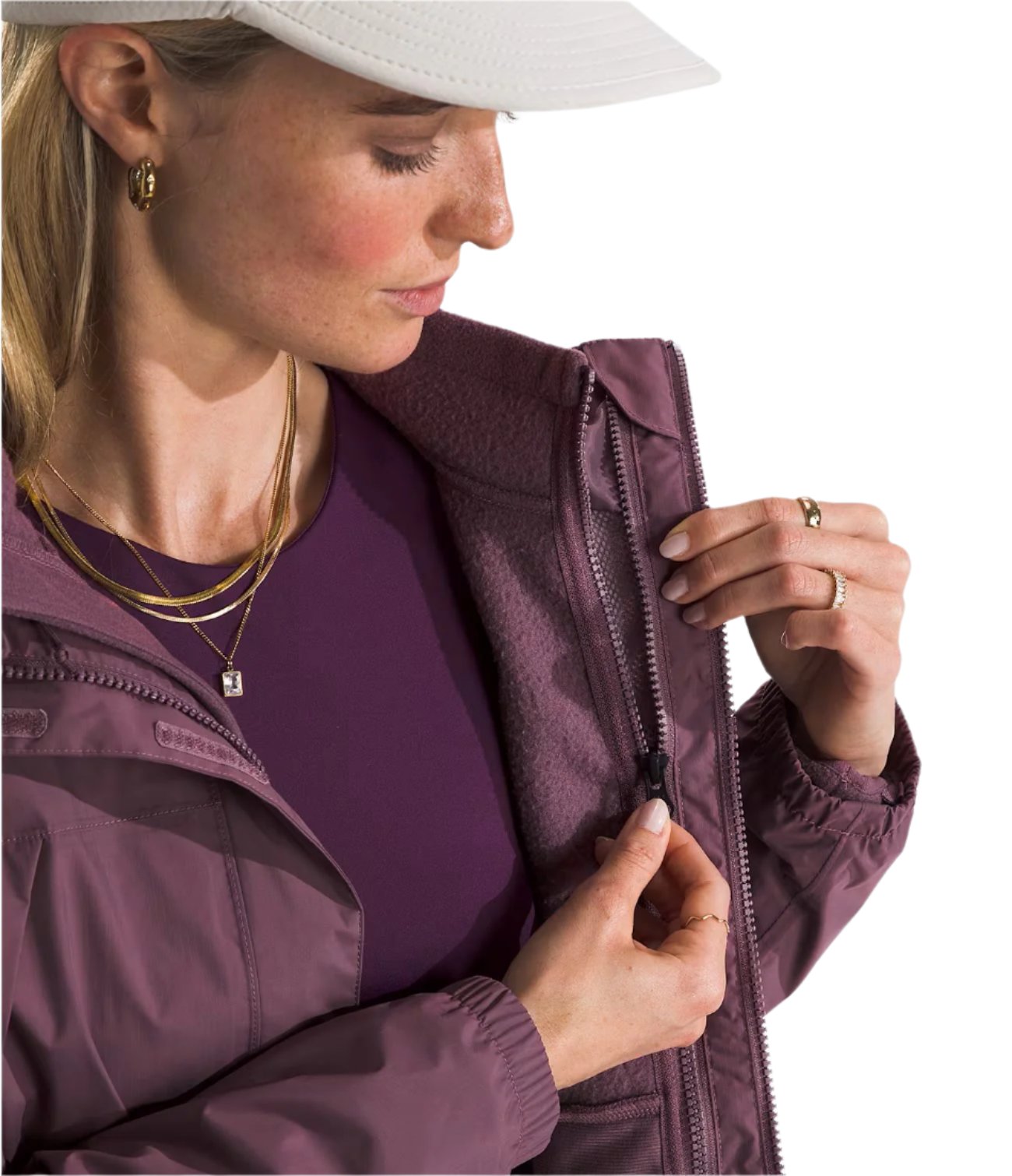 North Face Women's Antora Triclimate Jacket - A purple jacket with a zipper and two pockets on either side, worn by a model in front of a gray background.