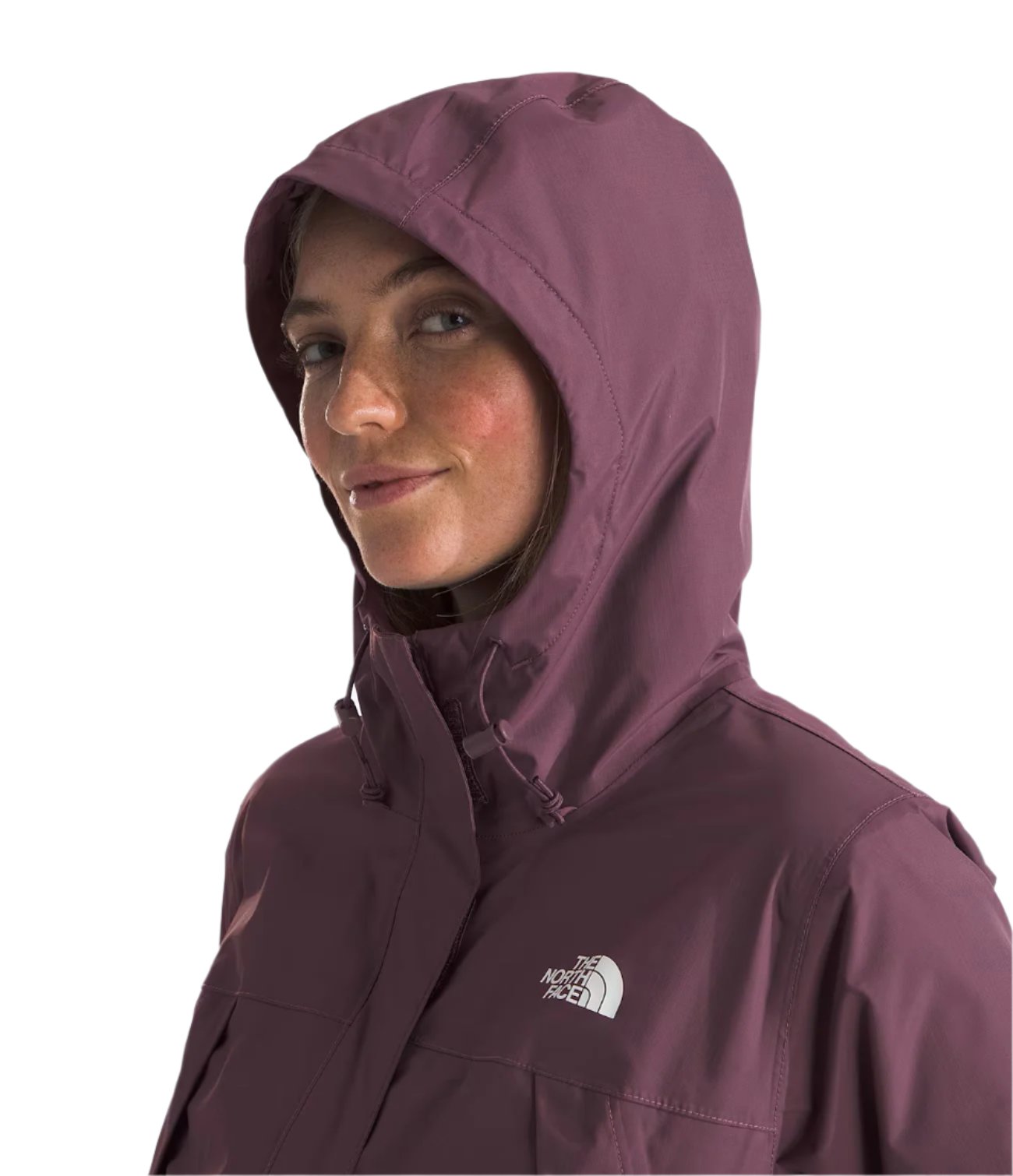 North Face Women's Antora Triclimate Jacket - A woman wearing a purple jacket with a hood, posing in front of a gray background.