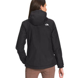 North Face Women's Antora Triclimate Jacket - A black jacket with a white logo on the upper left side of the back, worn by a woman with long brown hair facing away from the camera.