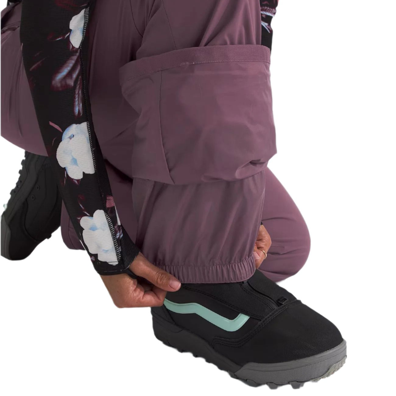 North Face Women's Freedom Stretch Pant 2025 - A pair of black pants with a subtle white pattern and a slight sheen to them, featuring an elastic waistband at the back.