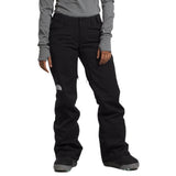 North Face Women's Freedom Stretch Pant 2025 - A pair of black women's snow pants with a white logo on the left thigh and a small pocket on the right thigh.