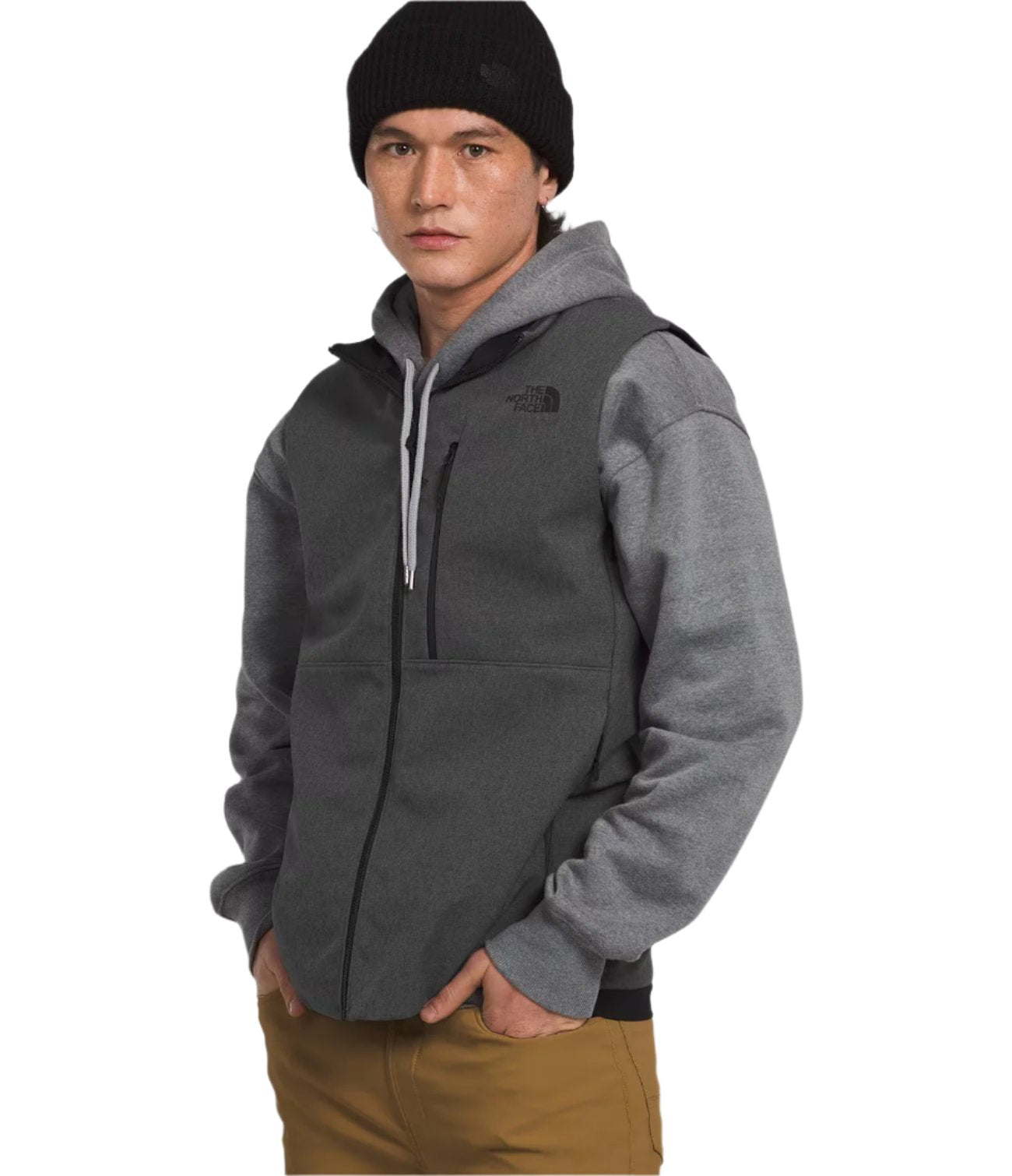 North Face Apex Bionic Vest - A dark gray vest with a zippered front and two side pockets, worn by a model over a light gray hoodie.