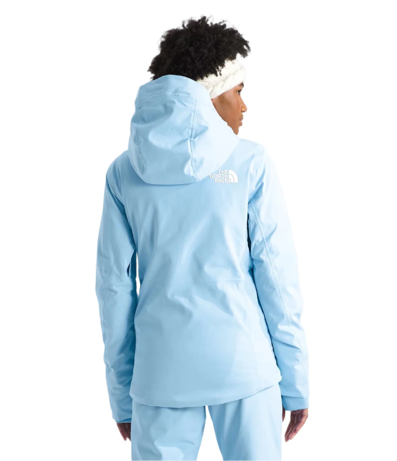 North Face Women's Lenado Insulated Jacket - A woman wearing a light blue jacket with a white logo on the back, standing in front of a plain background.