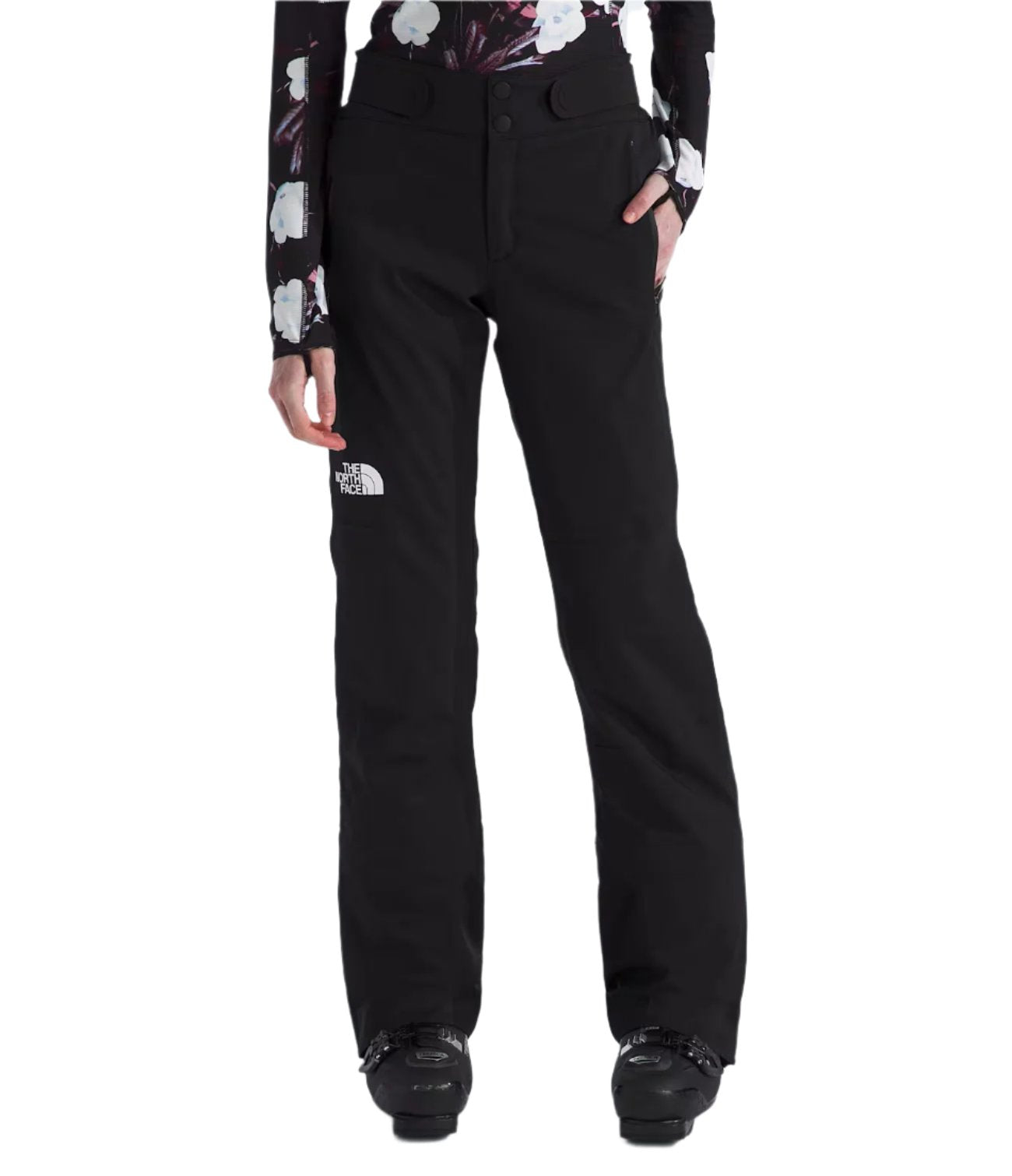 North Face Women's Lenado Insulated Pant - Black pants with white logo on left thigh and a floral patterned long-sleeve top worn underneath.