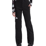 North Face Women's Lenado Insulated Pant - Black pants with white logo on left thigh and a floral patterned long-sleeve top worn underneath.