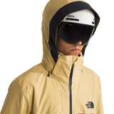 North Face Chakal Insulated Jacket - A tan-colored jacket with a black zipper and two zippered pockets on either side.