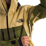 North Face Chakal Insulated Jacket - A tan-colored jacket with a black zipper and logo on the chest.