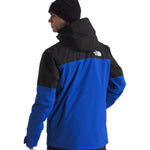 North Face Chakal Insulated Jacket - A black jacket with a blue stripe across the chest and down the sleeves.