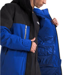 North Face Chakal Insulated Jacket - A black jacket with a blue stripe across the chest and down the sleeves.