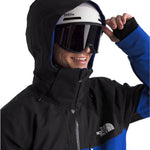 North Face Chakal Insulated Jacket - A black jacket with blue accents and a white logo on the chest.