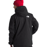 North Face Chakal Insulated Jacket - A black jacket with a white logo on the upper back, featuring a hood and zippered pockets.