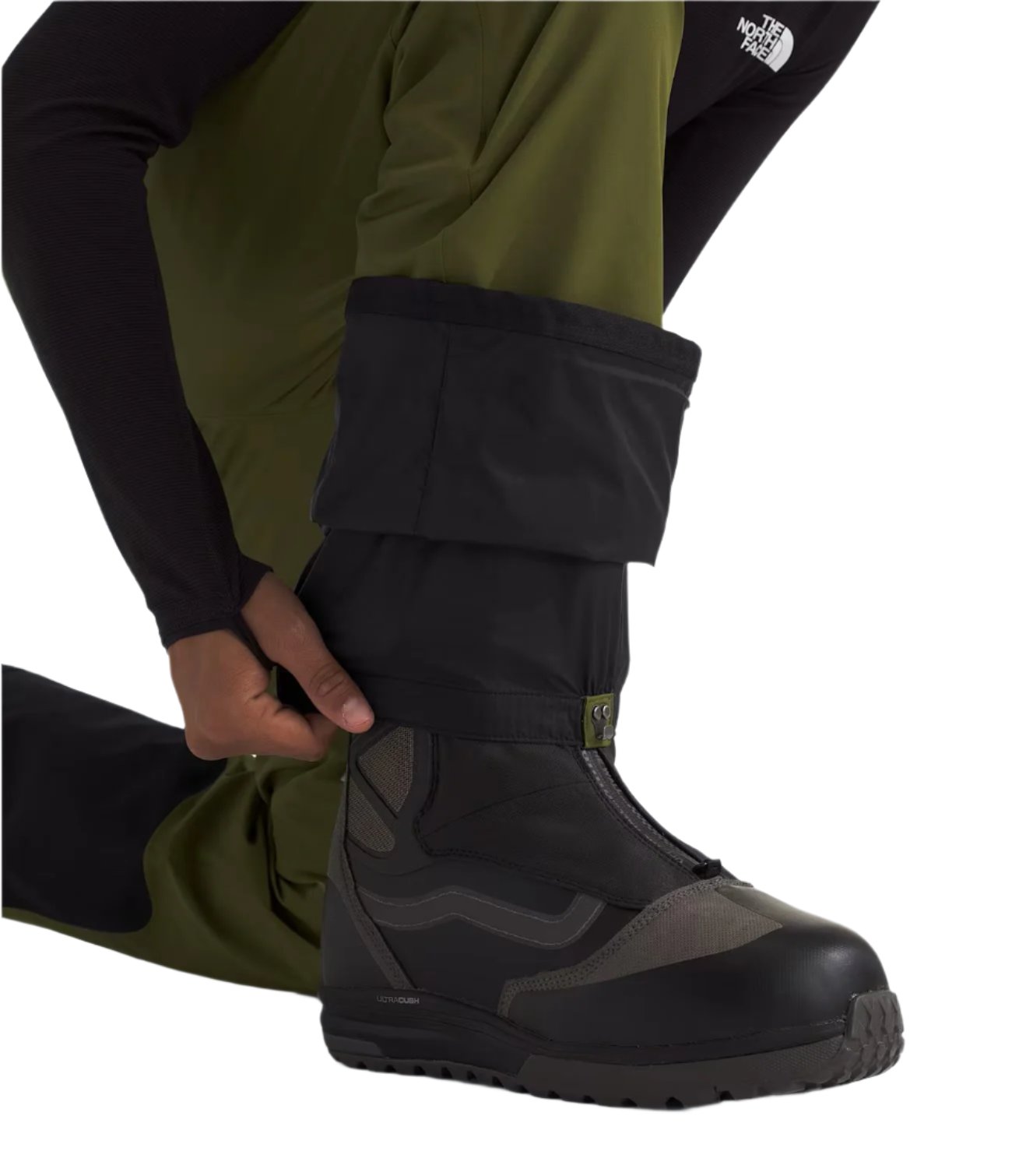 North Face Men's Chakal Insulated Pant Tall - A pair of olive green snow pants with a white logo on the left thigh and black accents around the ankles.
