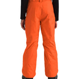 North Face Boys' Freedom Insulated Pant - A pair of bright orange snow pants with a black logo on the left leg and a belt loop at the waist.